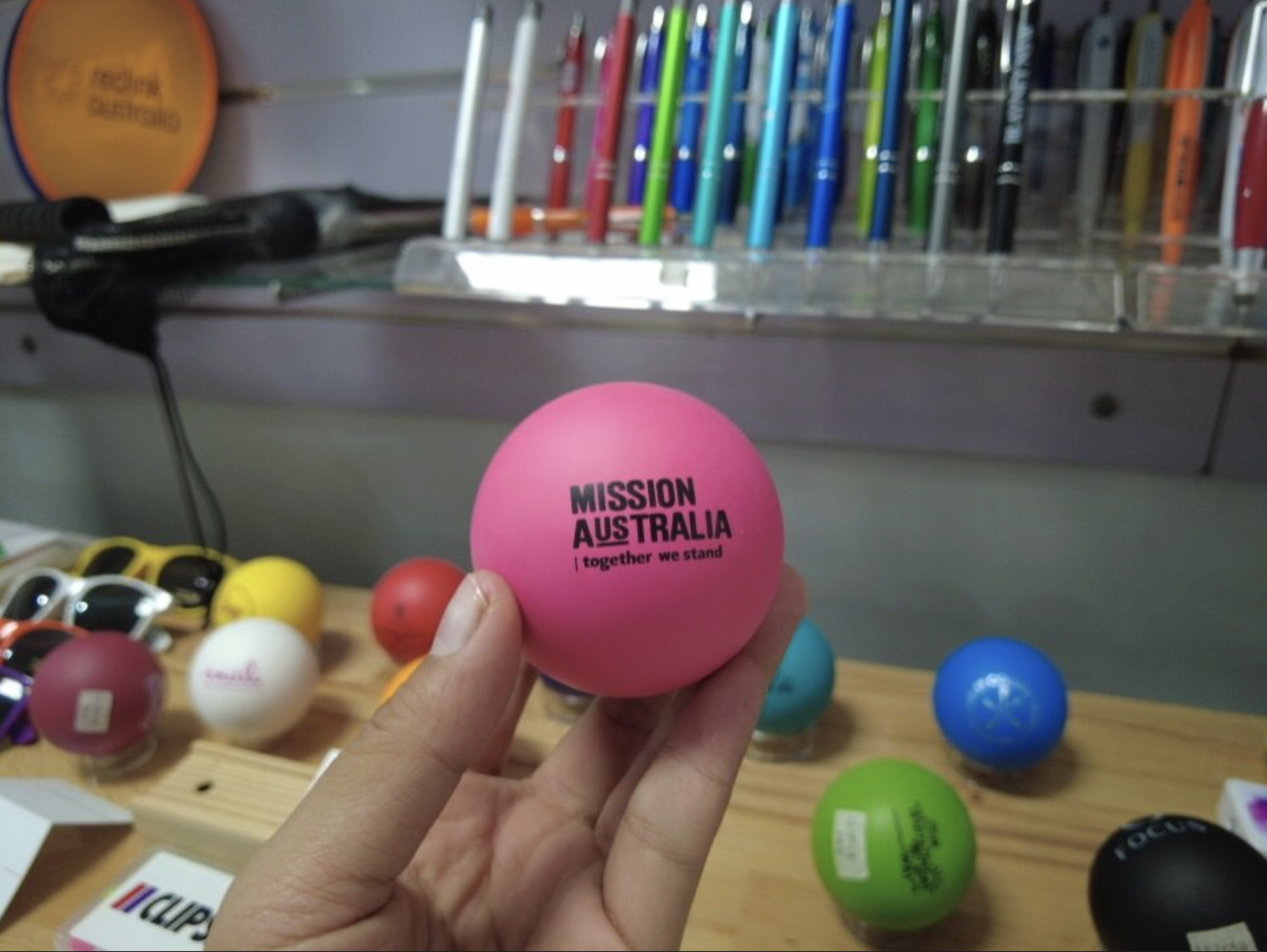 pink stressball with Mission Australia logo