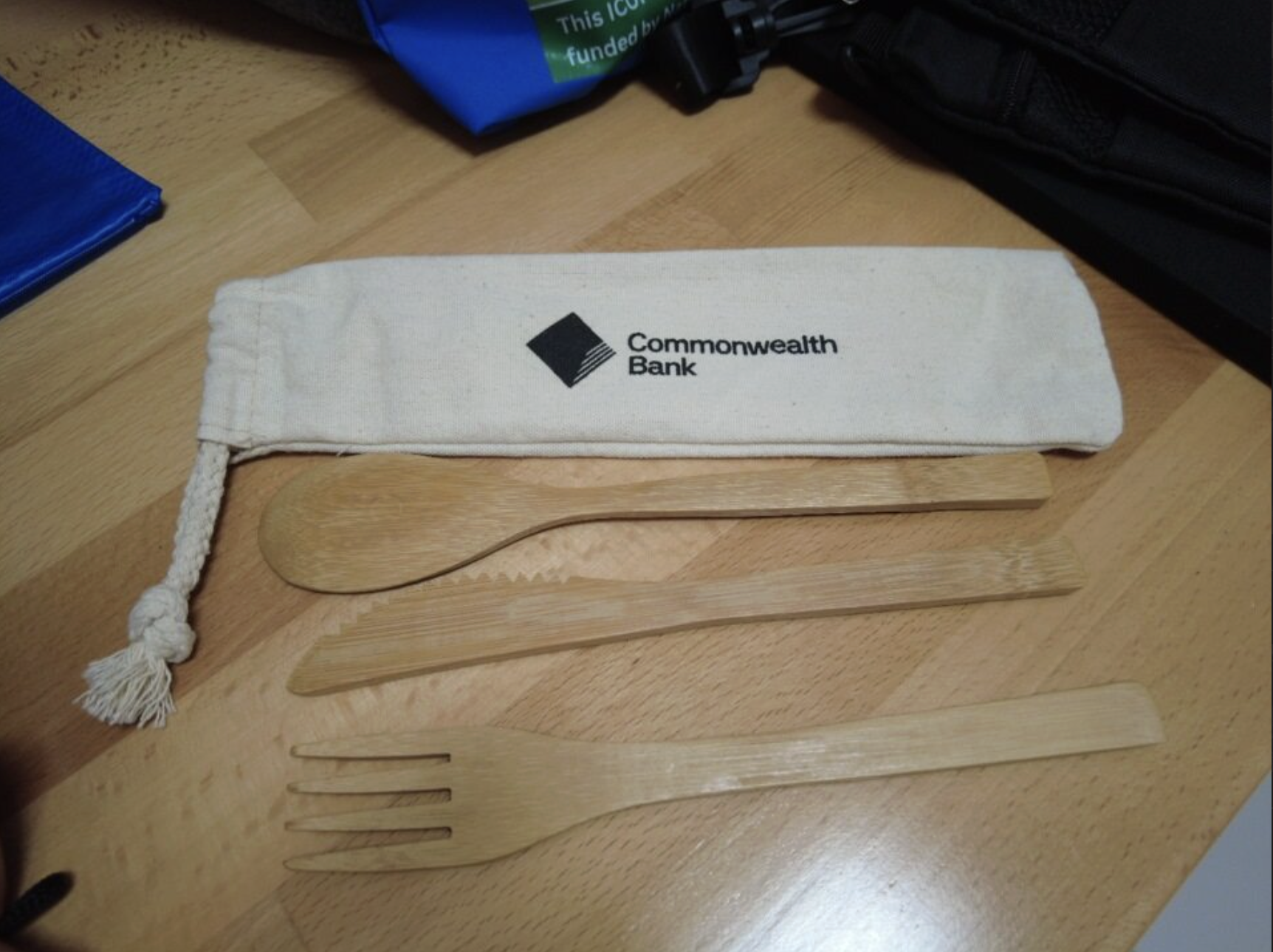 white eco friendly bag with eco friendly cutleries on a table