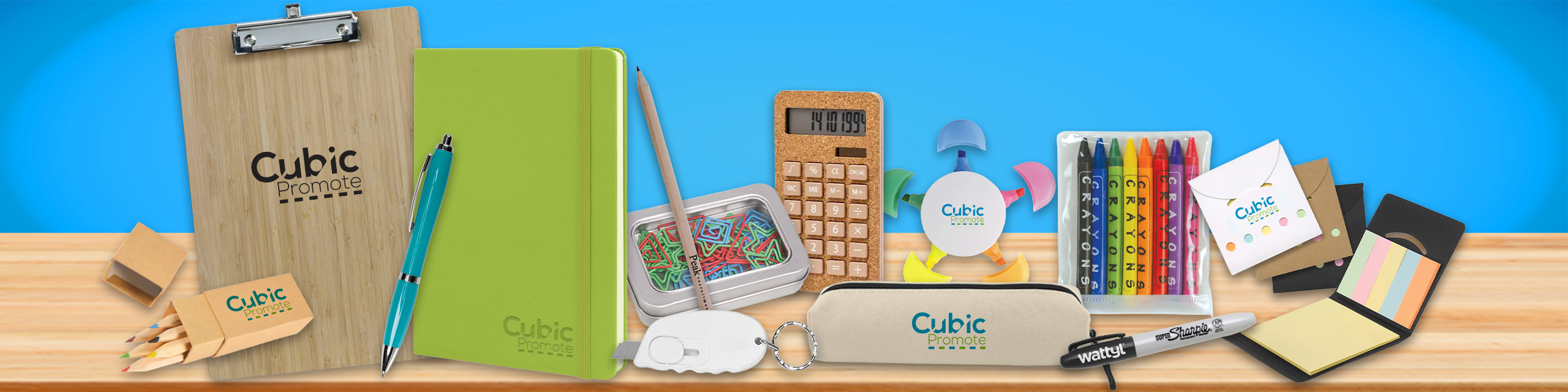 Assorted office supplies on a desk, including notebooks, pens, calculator, and sticky notes.