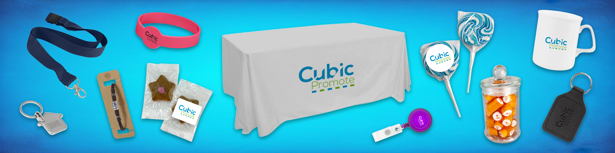 Promotional items with Cubic Promote logo on blue background, including mug, lanyard, and sweets.