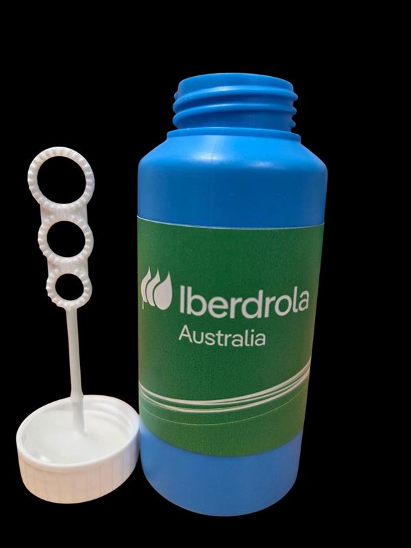 Blue bubble bottle labeled Iberdrola Australia, classic promotional toy with wand and cap on side.