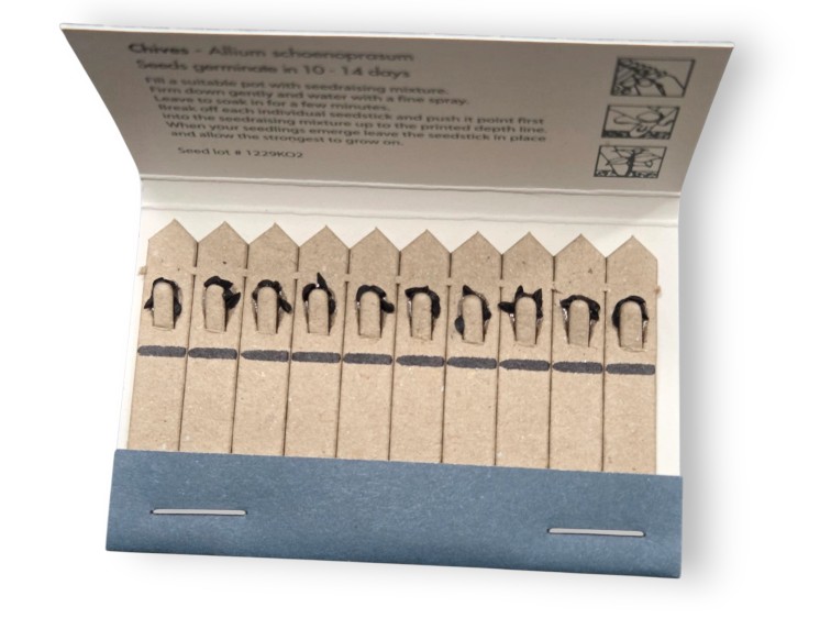 Promotional seedsticks packet with multiple plantable sticks arranged in a neat row.