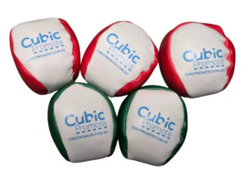 Five white hackysacks with red and green sides, branded Cubic Promote.