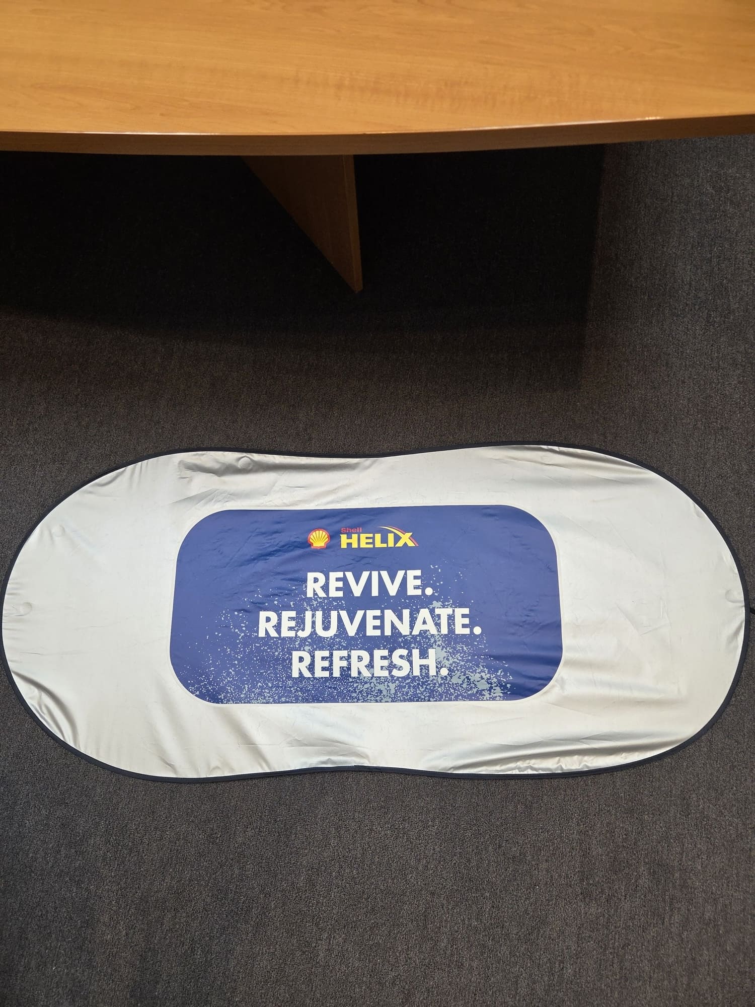 Oval Shell Helix banner on carpet reading Revive. Rejuvenate. Refresh.