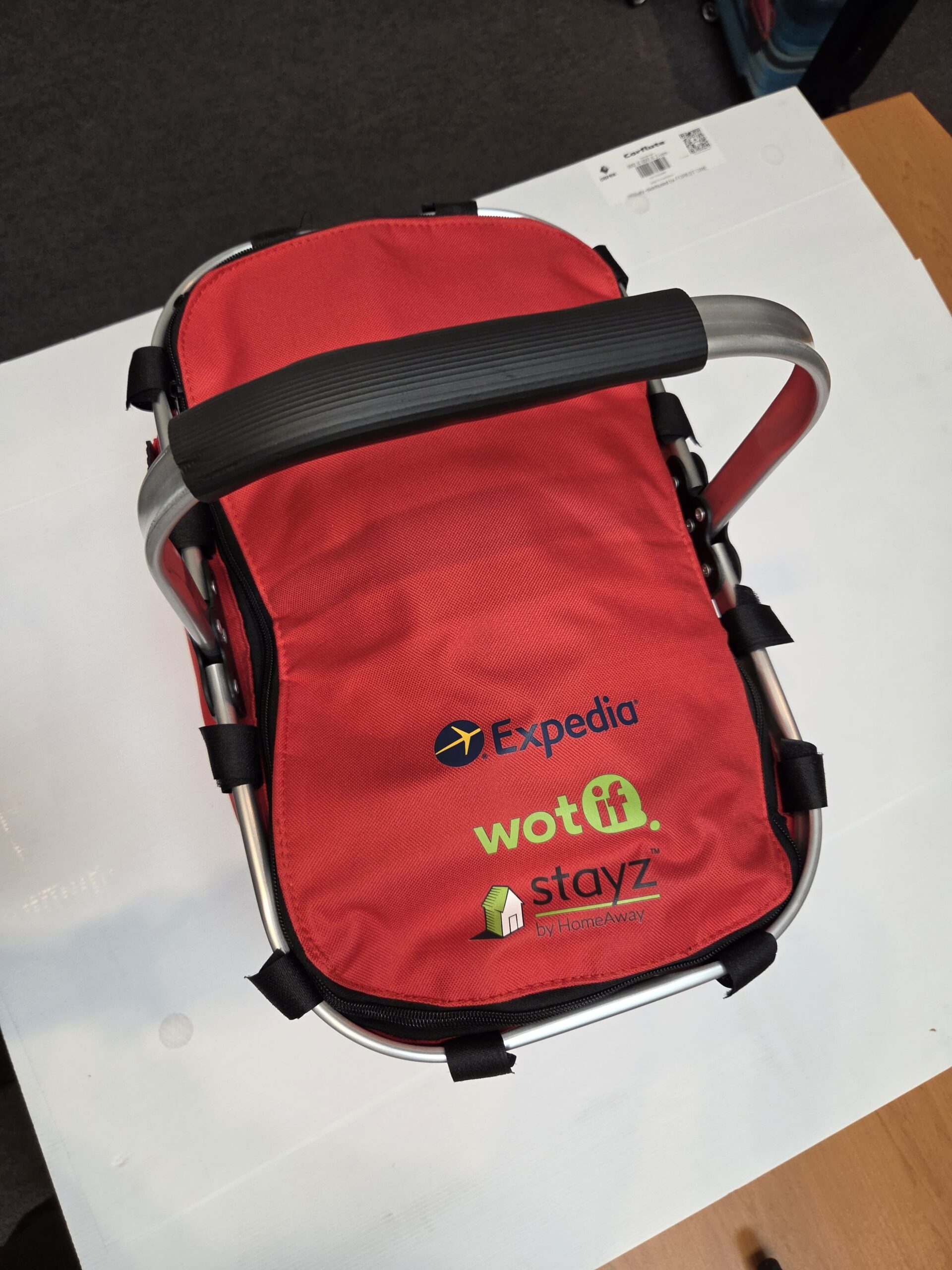 red picnic cooler basket with logos