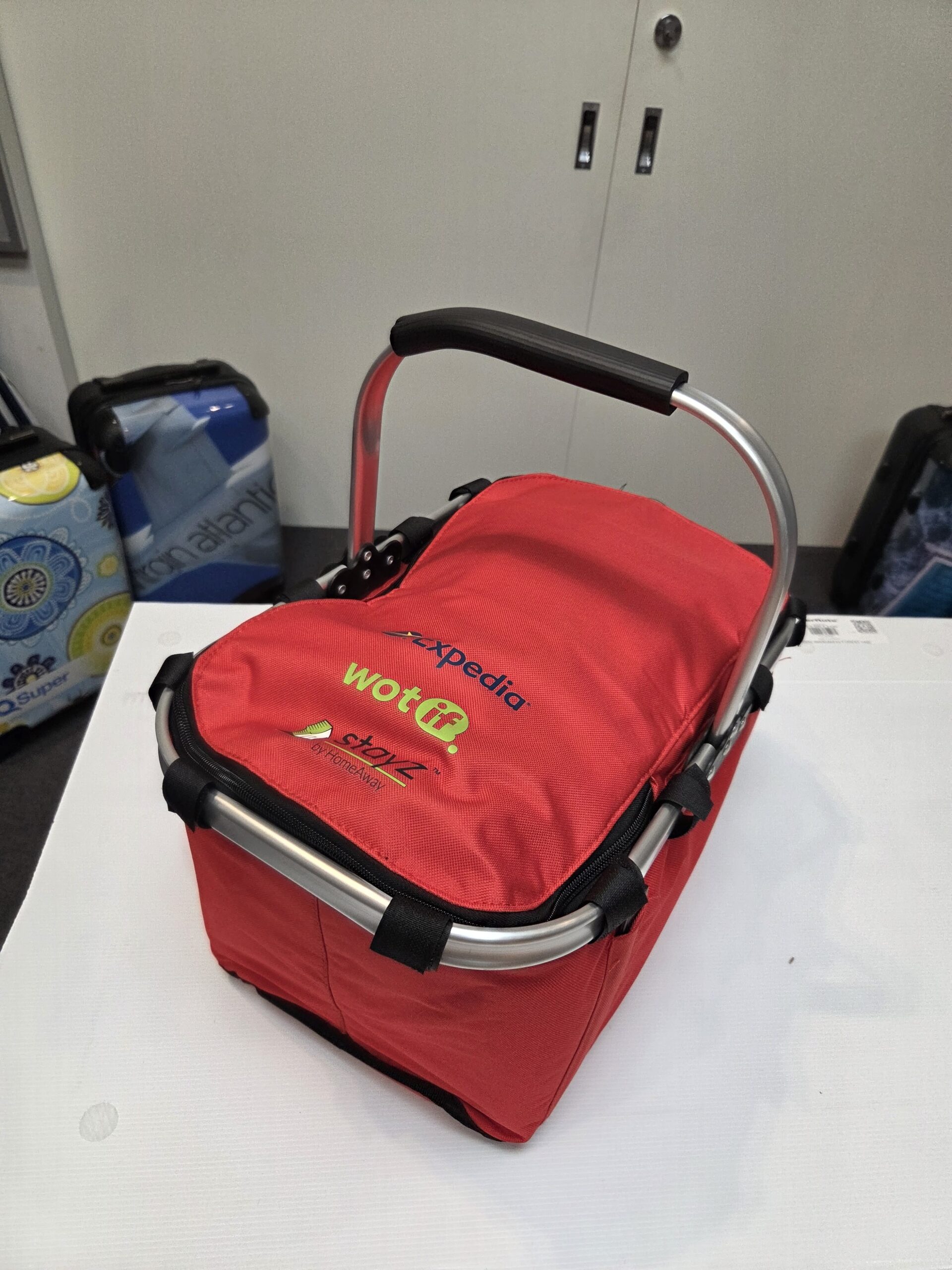 red picnic cooler basket with black handle