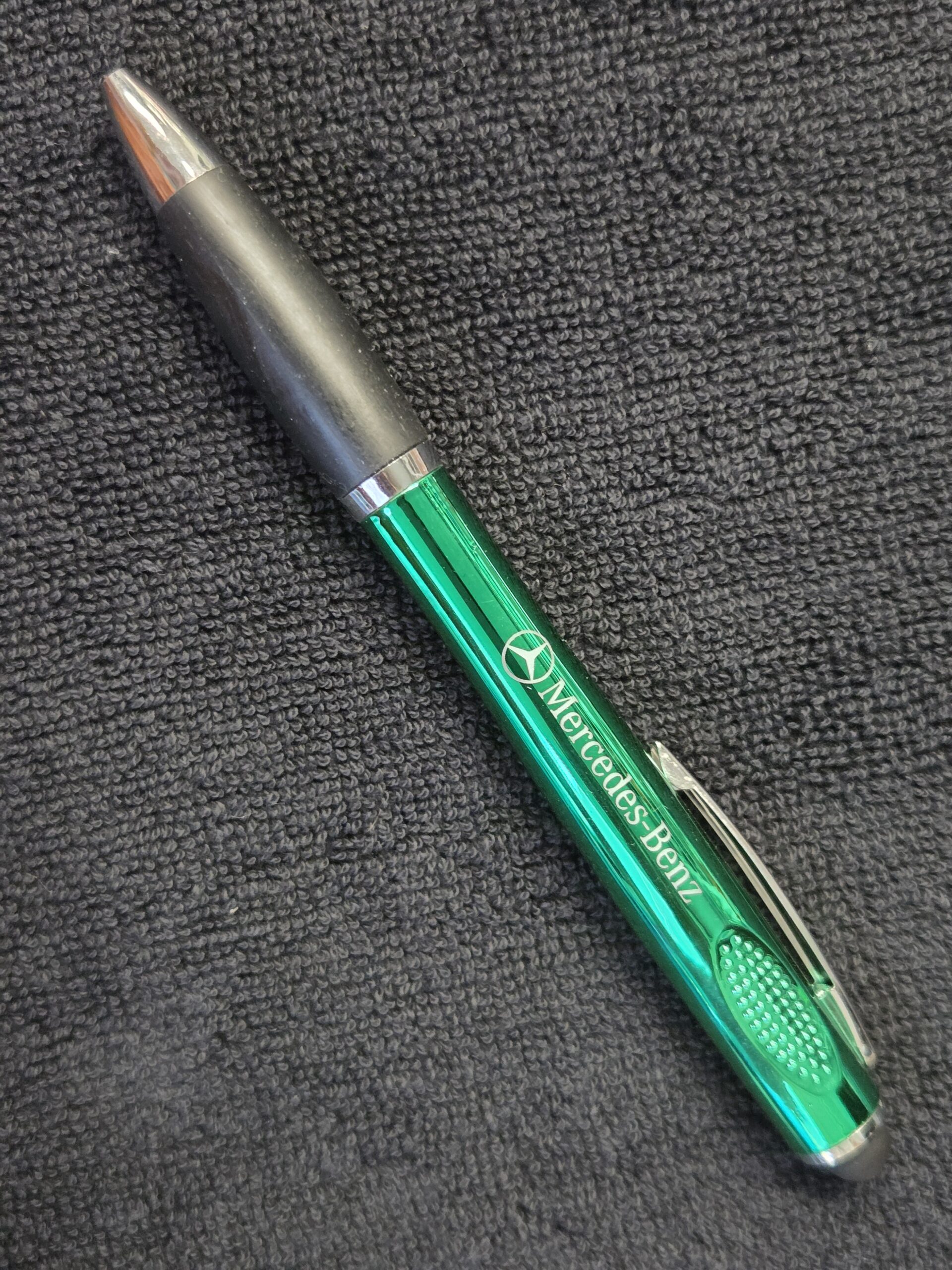 green and grey coloured pen with Mercdes Benz logo