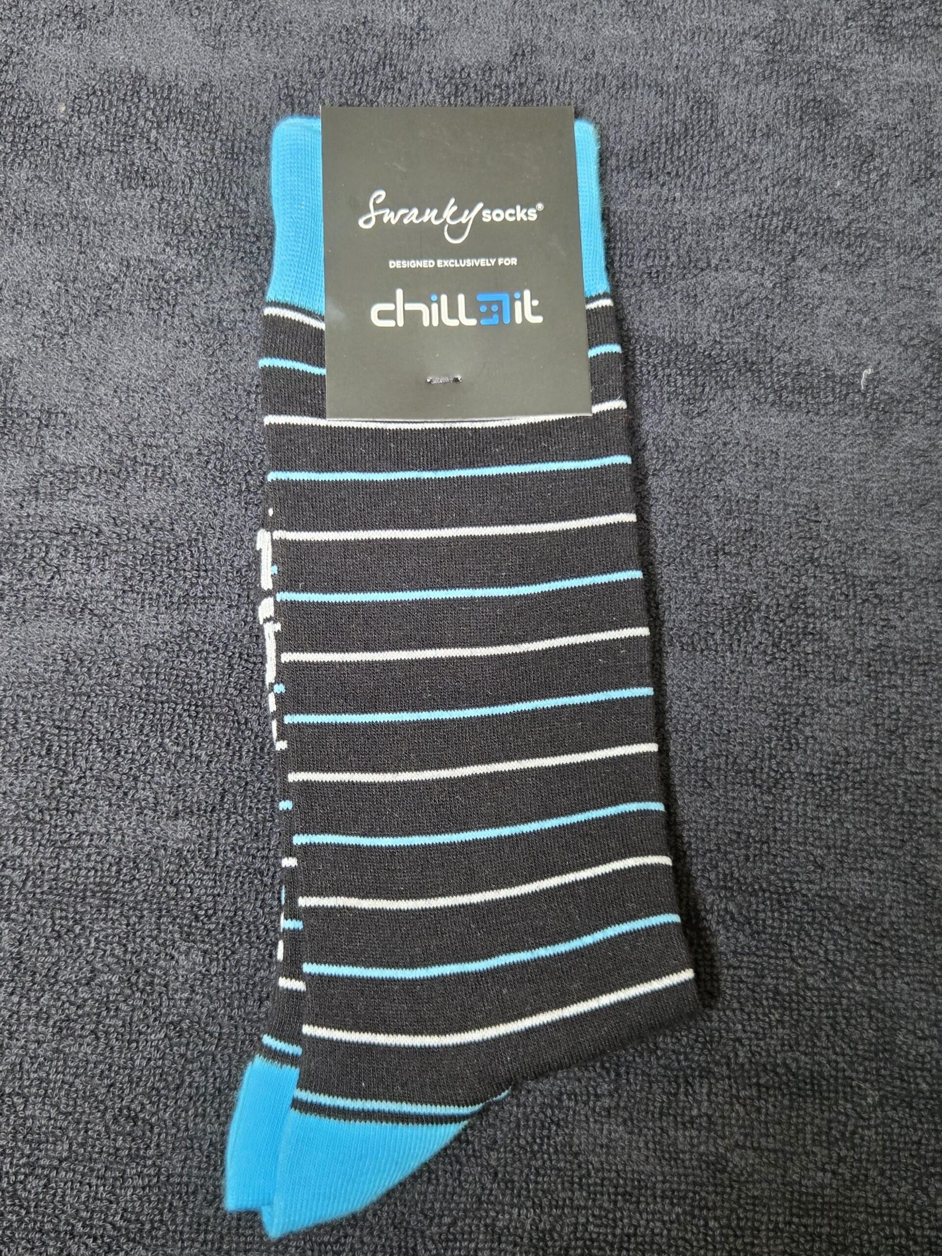 A pair of black Swanky Socks with blue and white stripes, perfect for a Chill IT client story.