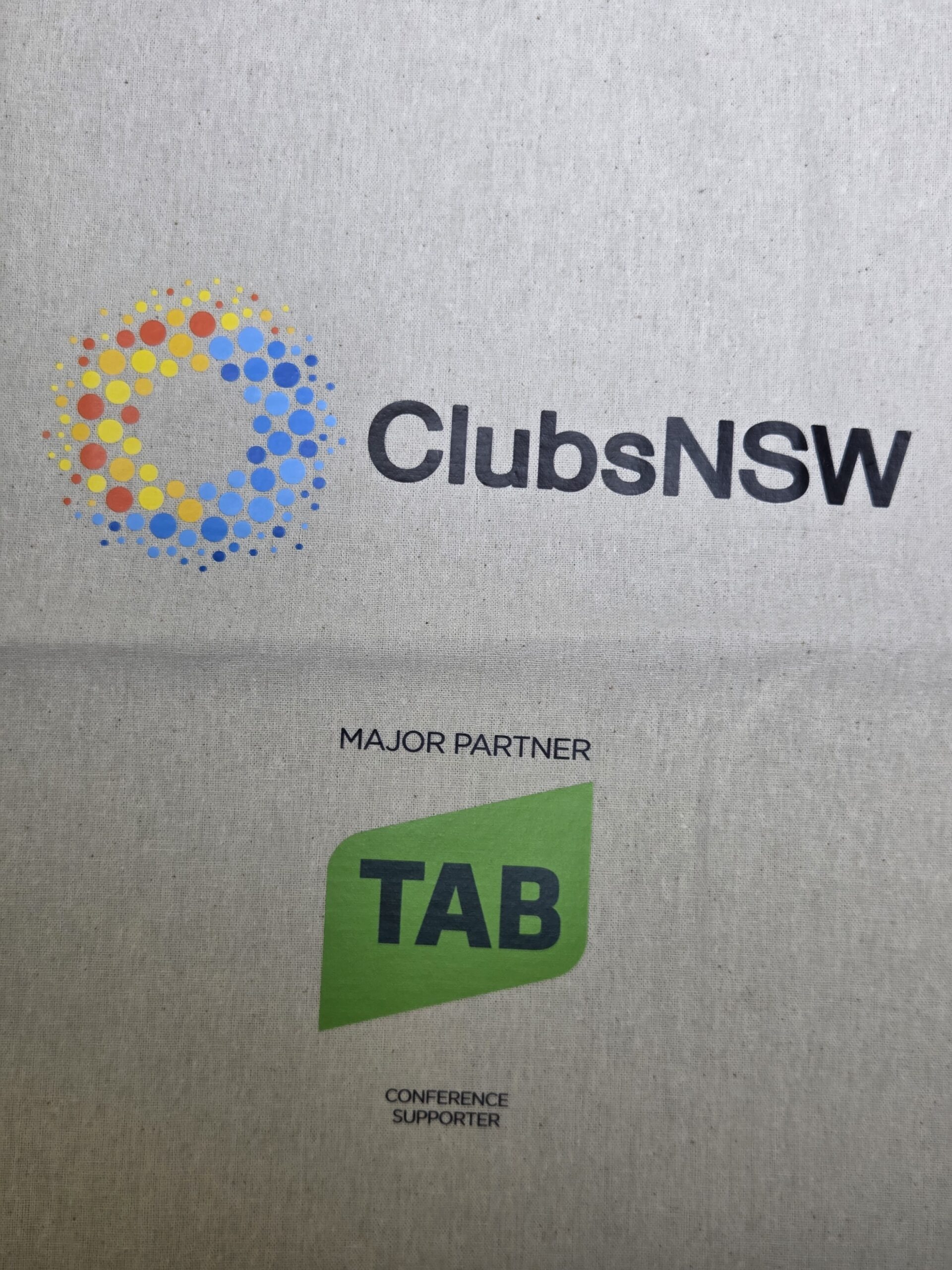 ClubsNSW logo above the TAB logo with text: Major Partner, ClubsNSW Conference Supporter.