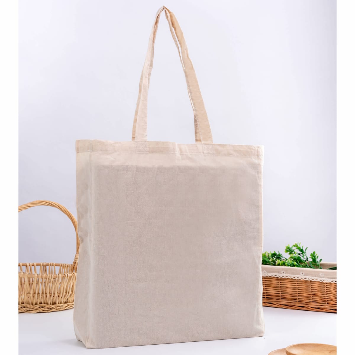Calico Bag With Gusset - rush stands upright on white surface, wicker baskets behind.