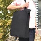 Person holding Event Eco Calico Bags - rush outdoors—ideal for busy days or events.