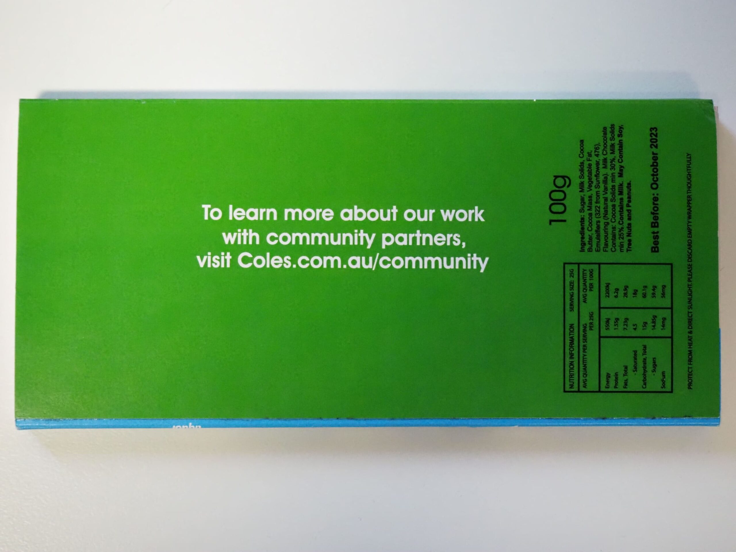 Green Coles package with white text highlighting Coles Community work and website link.