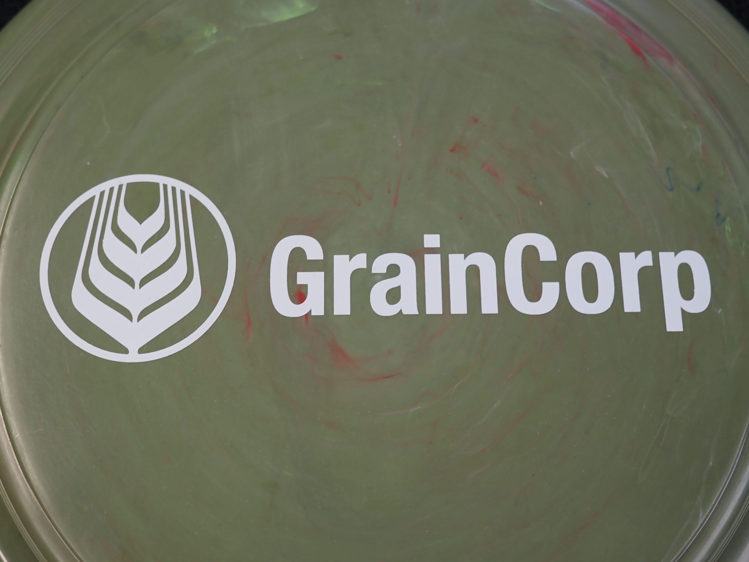 GrainCorp logo and name featured on a green surface for this client story.