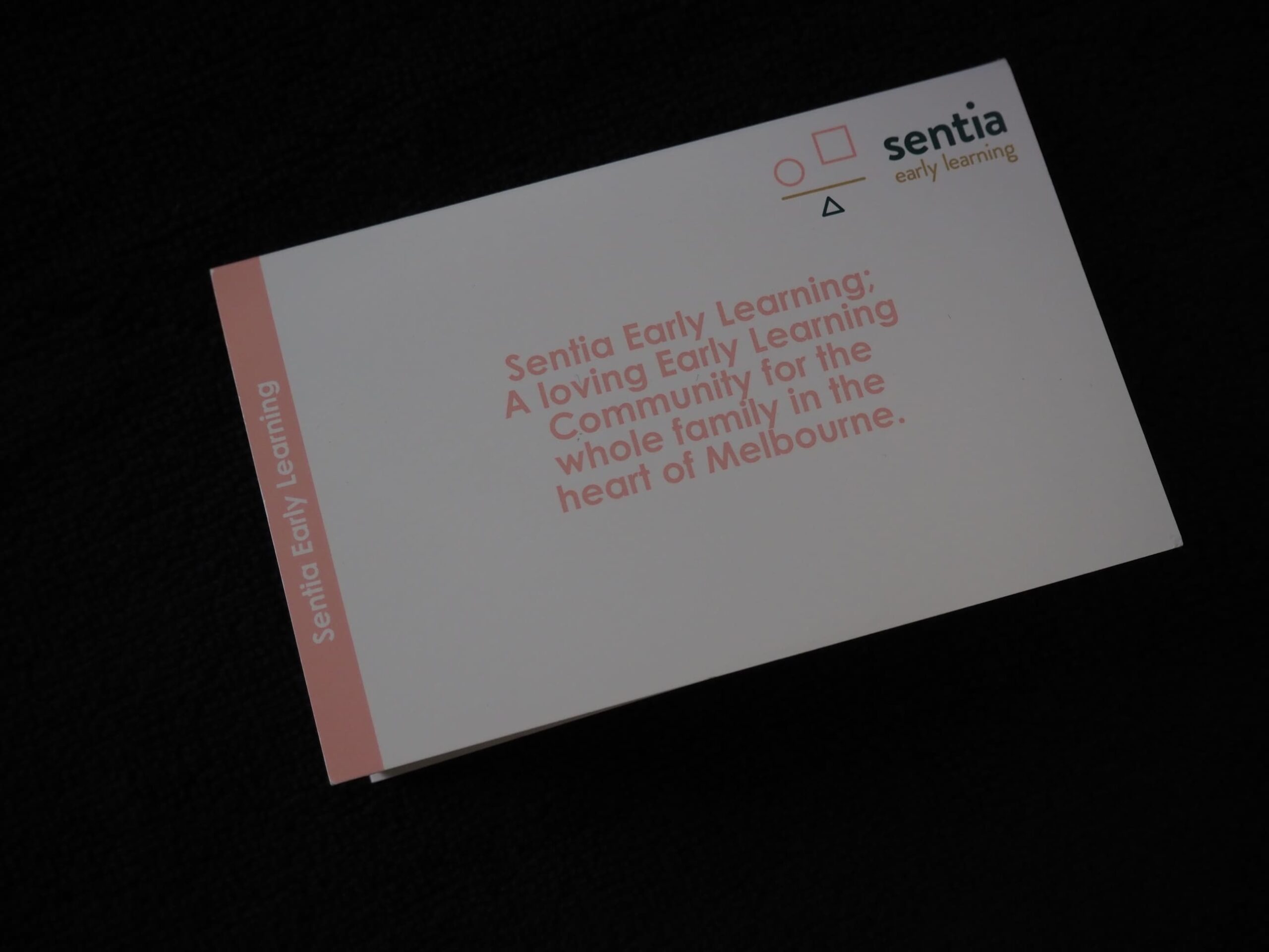A Sentia Early Learning card on a black surface highlights early learning in Melbourne.