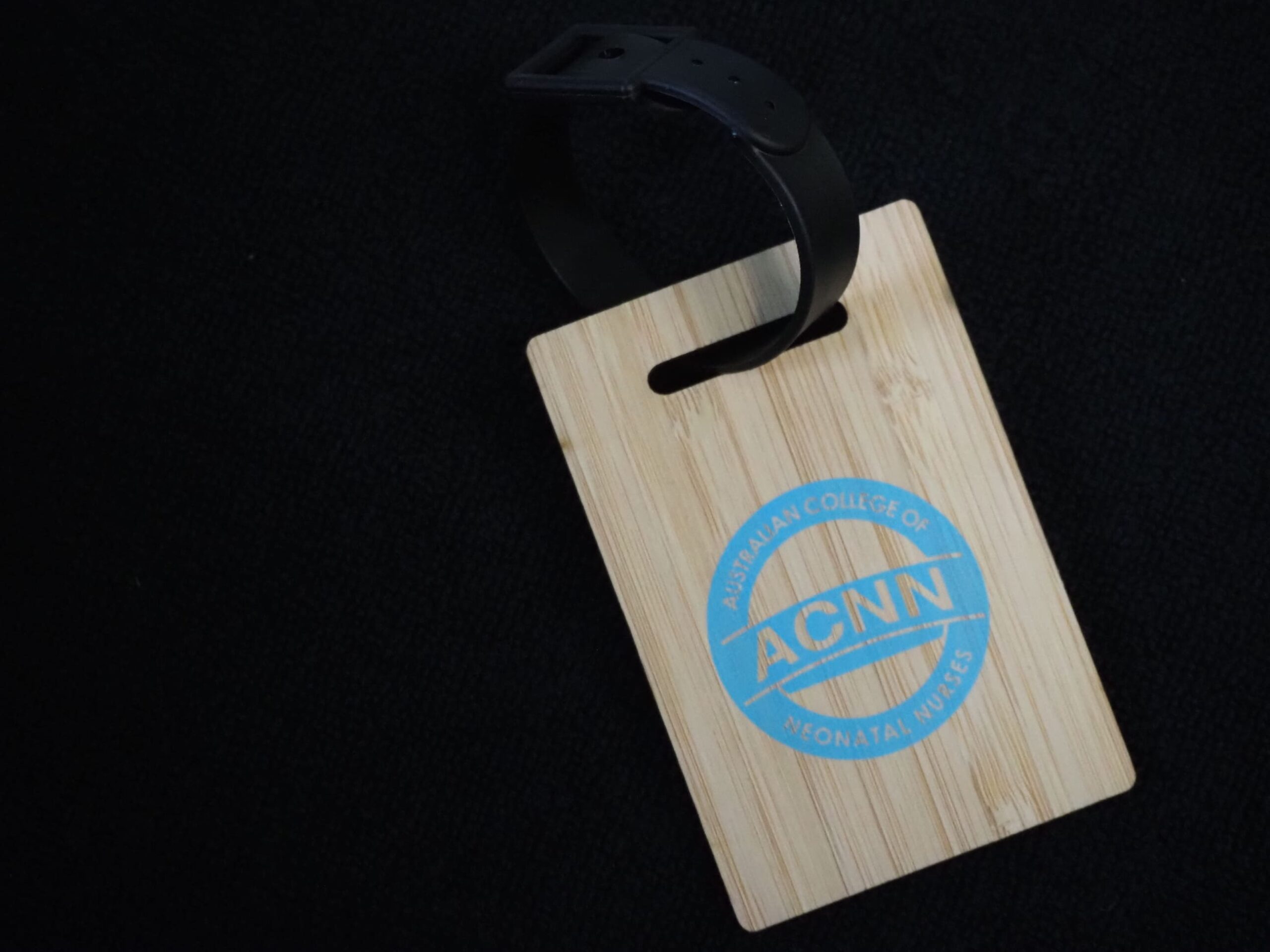 Wooden badge with ACNN logo, perfect for neonatal nurses in Australia; includes black lanyard.