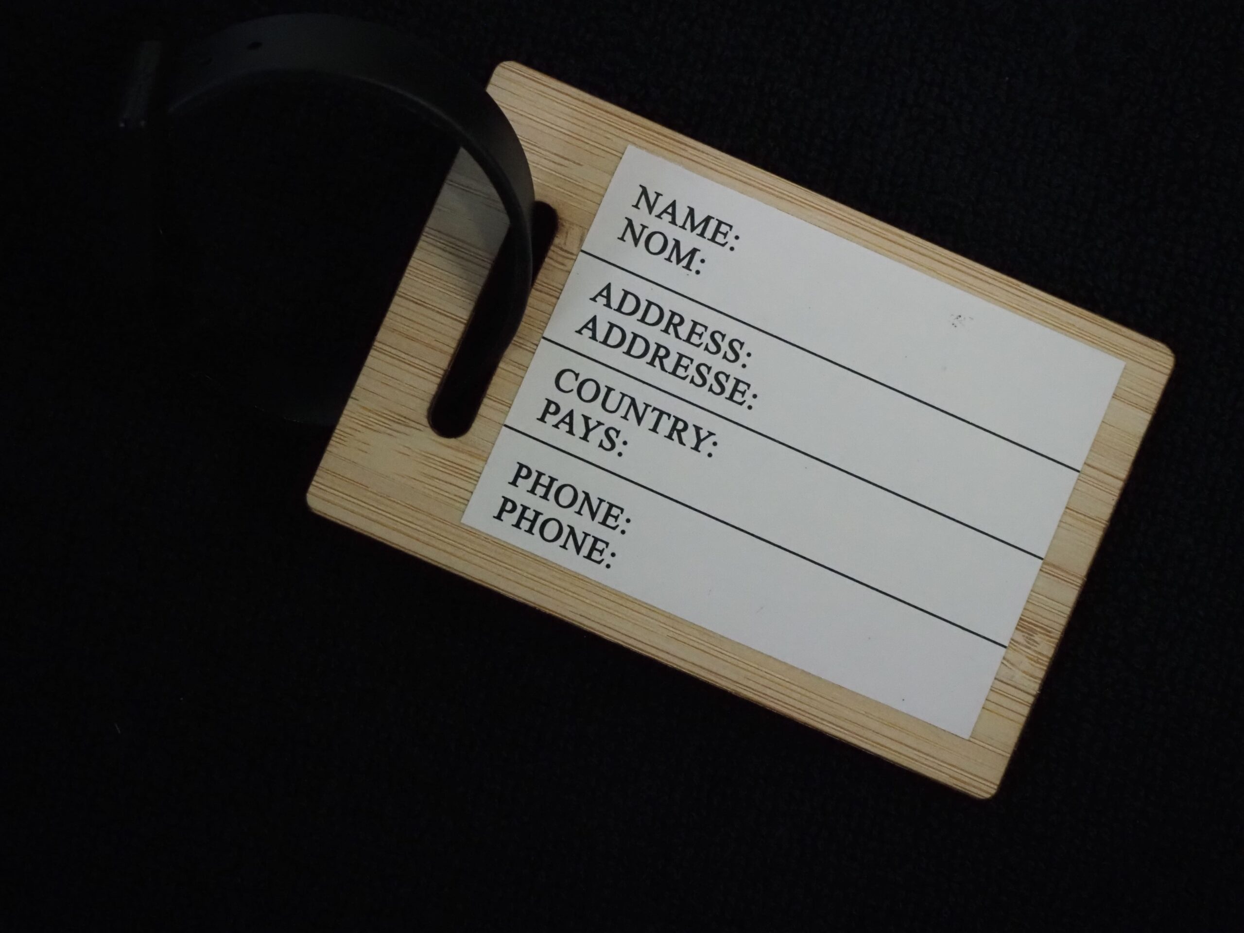Wooden luggage tag with fields for name, address, country, phone—ideal for neonatal nurses.