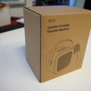 A cardboard box labeled Caroline Portable Karaoke Machine, perfect for placing an order.