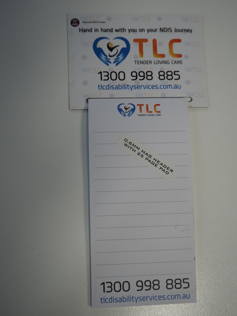 TLC notepad and card with contact info and logo, perfect for disability support services.