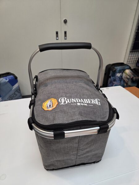 A gray Bundaberg Rum cooler basket—perfect for christmas gifts—on a white surface.