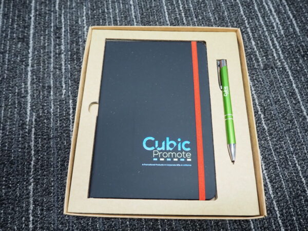 Corporate gifting guide: Notebook with Cubic Promote logo and green pen, perfect for Australia.
