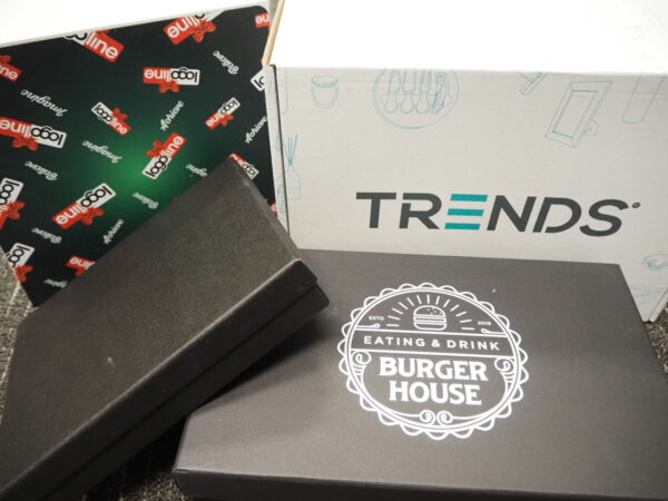 Stacked boxes labeled TRENDS, BURGER HOUSE, and Loopline inspire corporate gift box ideas.