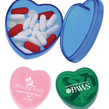 Three heart-shaped pillboxes for multicultural aged care: blue with pills, pink, and green with logos.