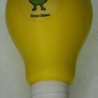 Get the Stress Ball Light Bulb - rush in yellow with a smiling cartoon and "Great ideas." on top!.