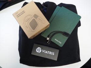 A branded welcome kit for new employees: hoodie, notebook, speaker, cable, and VIATRIS box.