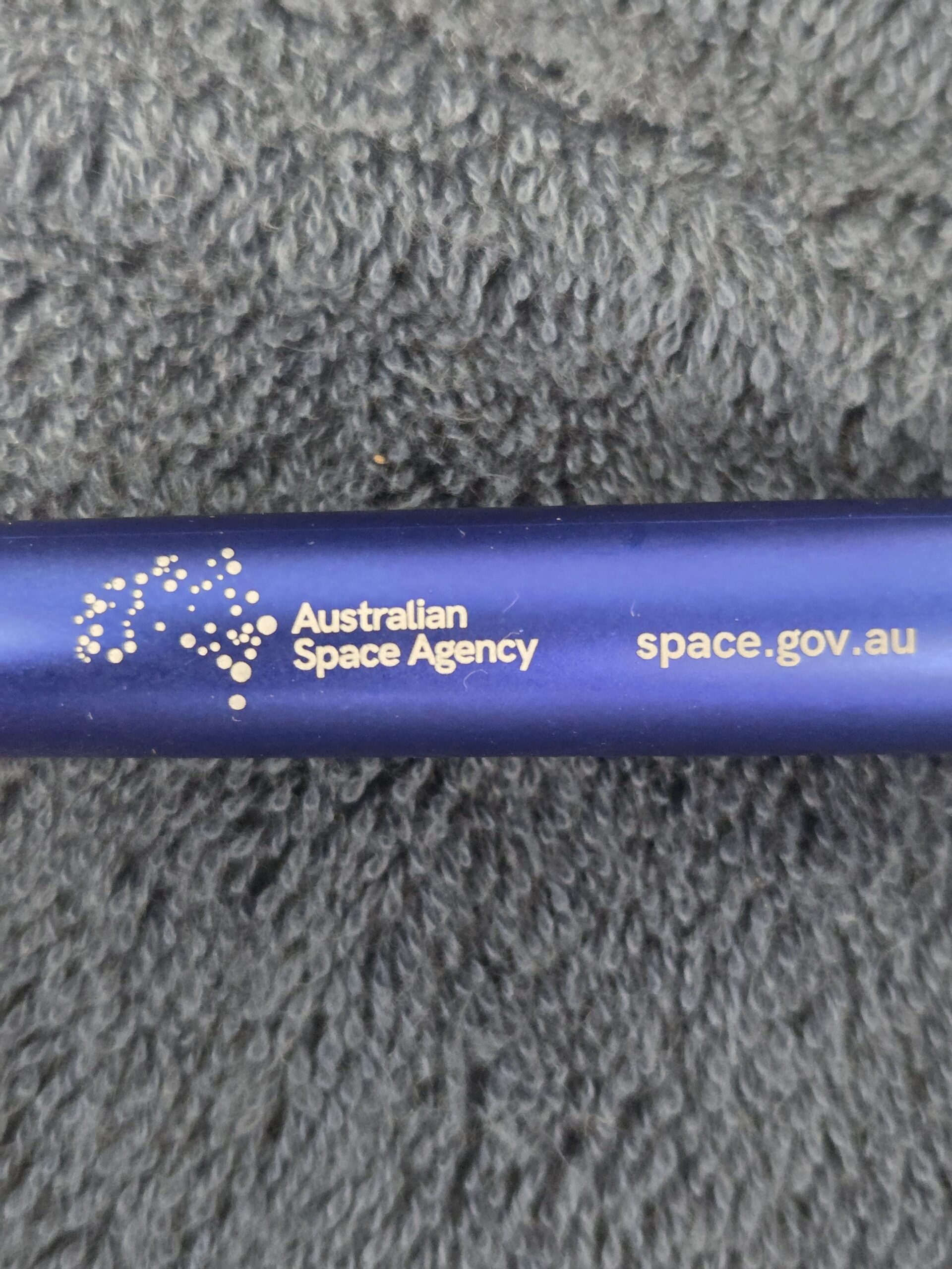Blue pen with Australian Space Agency and space agency website printed in white lettering.