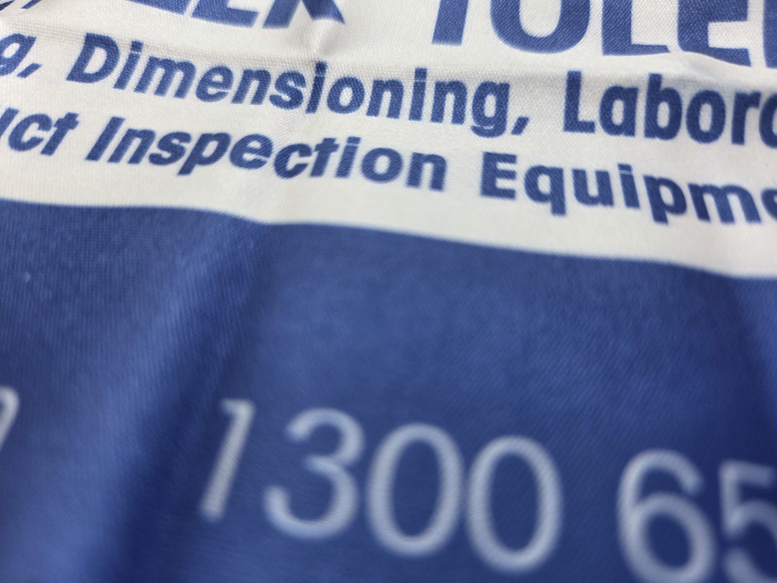 Close-up of blue and white fabric with partial Mettler Toledo text and numbers.