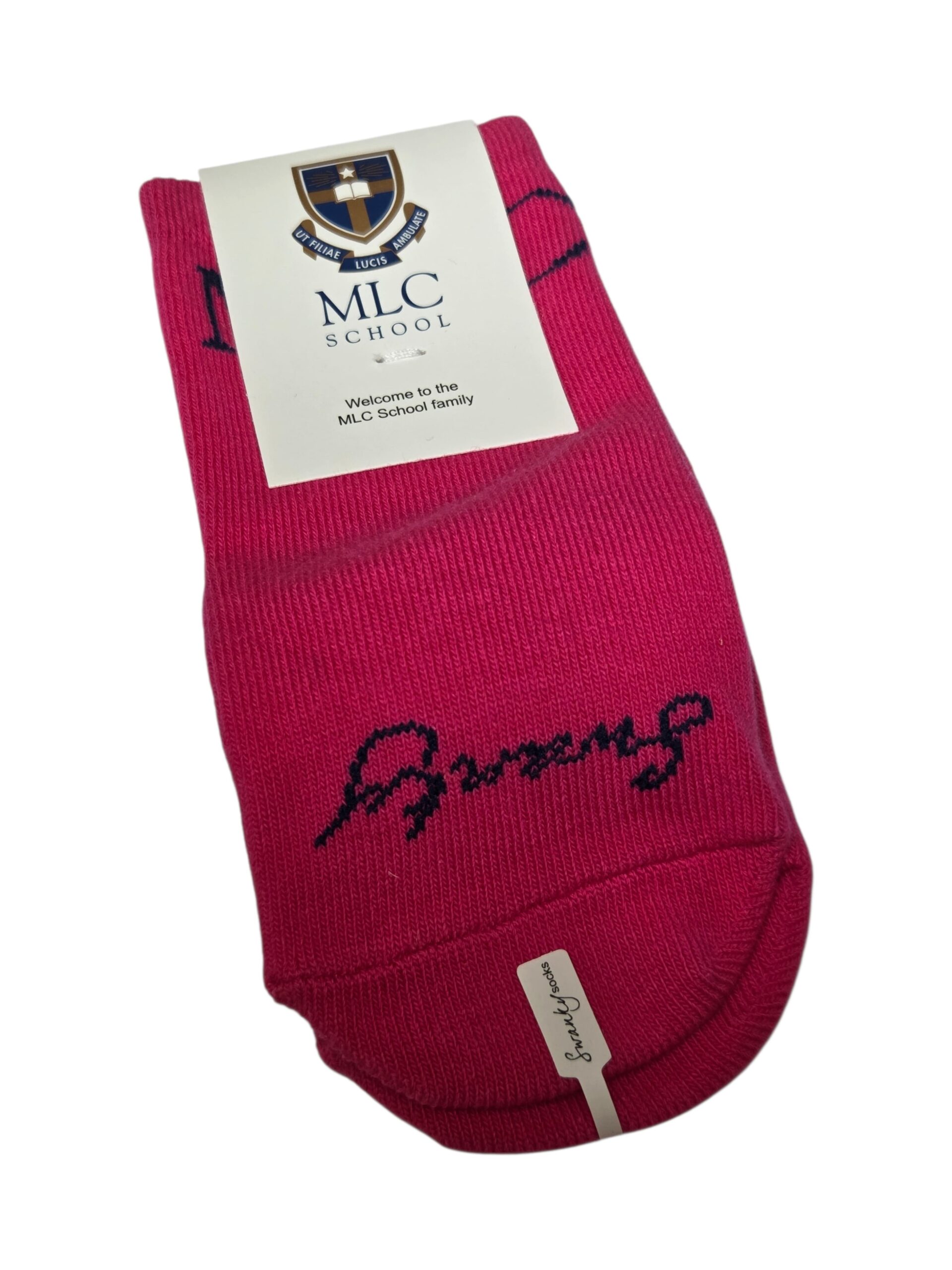 Pink socks with MLC School label and Client Story cursive writing on the toe.