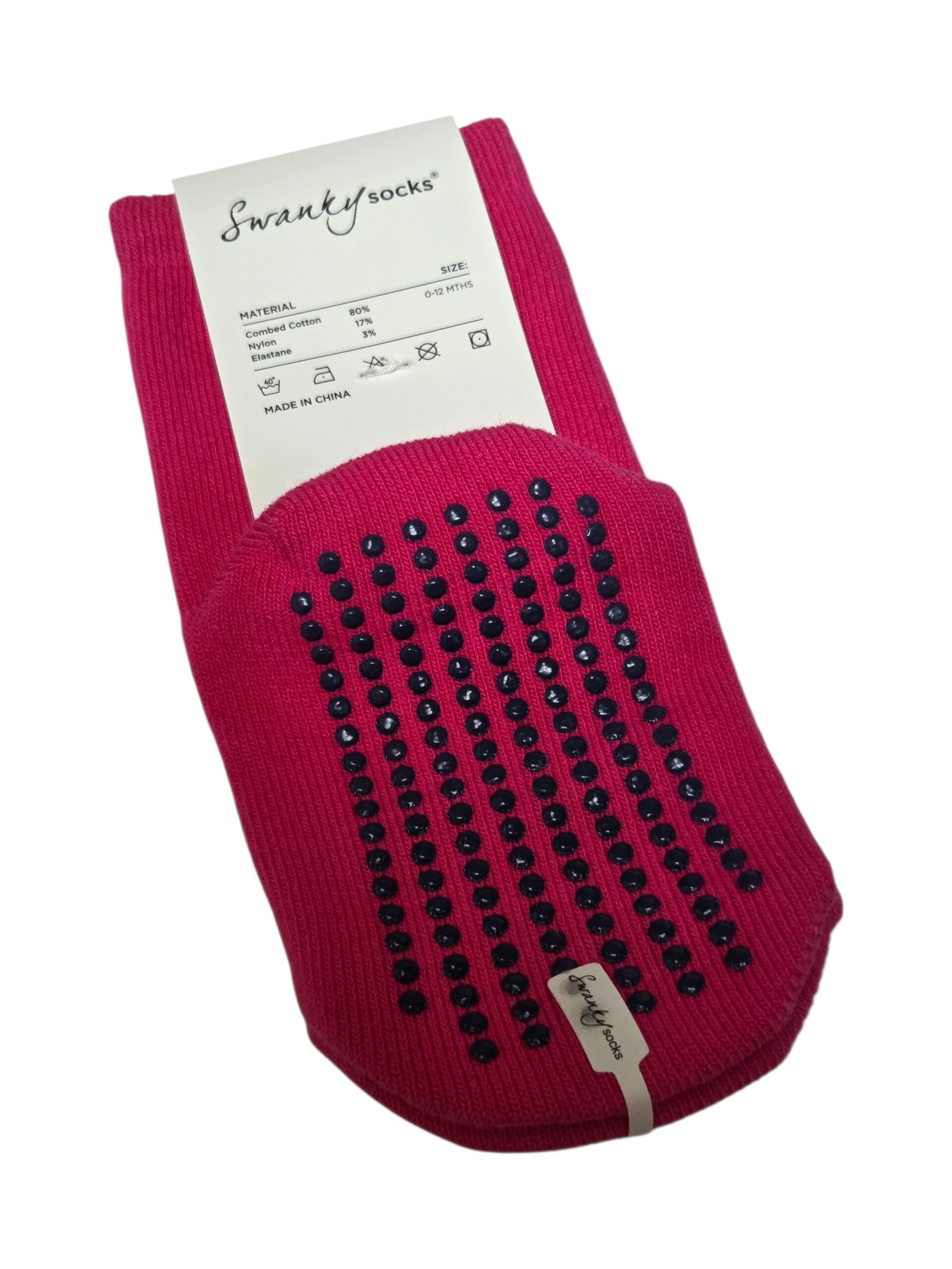 Bright pink Swanky Socks with black grip dots, as featured in our MLC School Client Story.