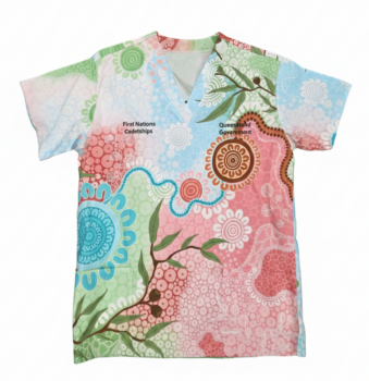 Colorful scrub top featuring custom merchandise with floral, dot designs by Aboriginal Artists.