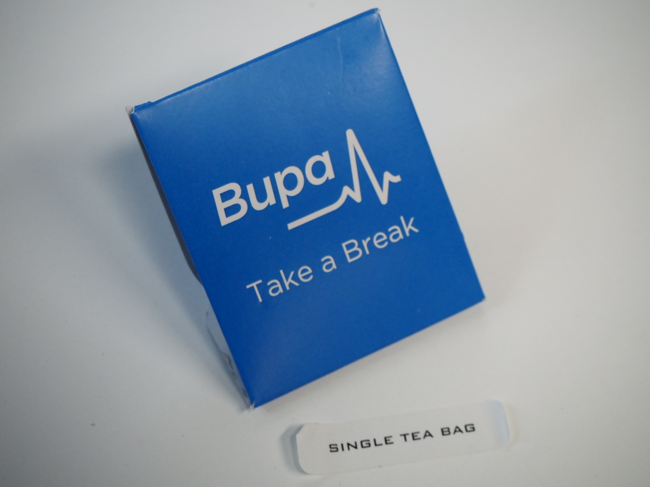 Blue Bupa Take a Break box with SINGLE TEA BAG label, perfect for sharing Client Story moments.