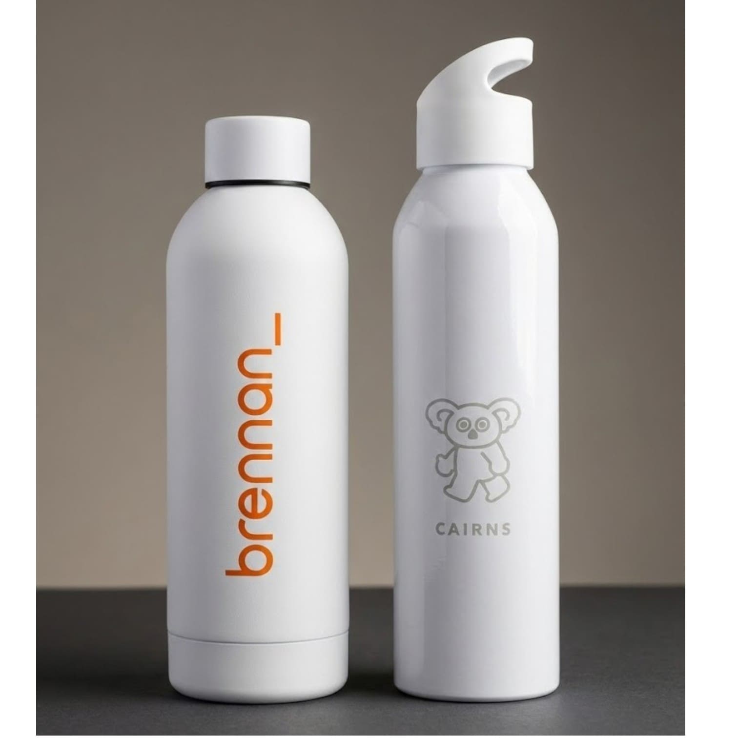 Two white water bottles reflect product trends, one labeled brennan_, one with a koala and CAIRNS.