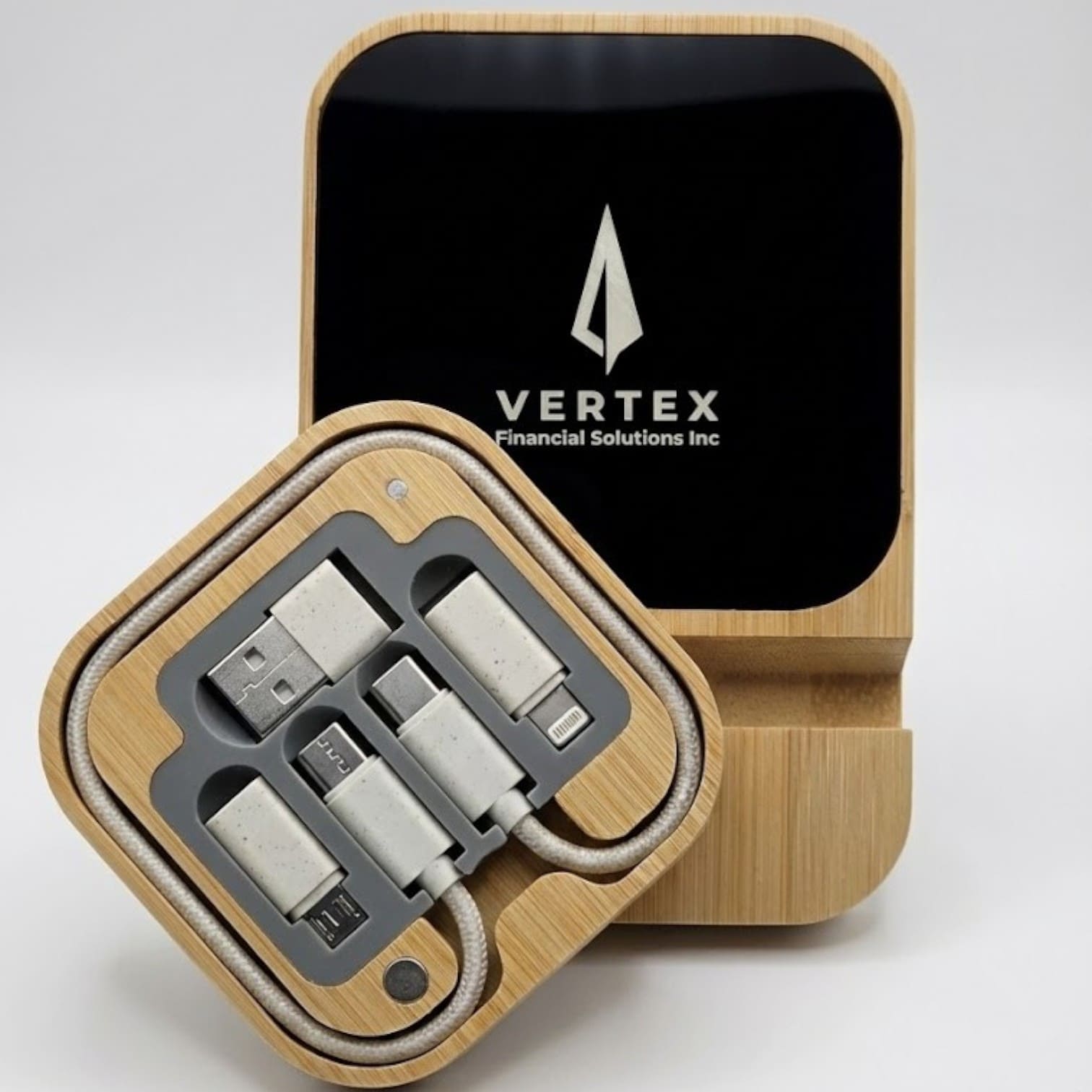 Square bamboo tech kit with charging cables, reflecting the latest product trends in tech.