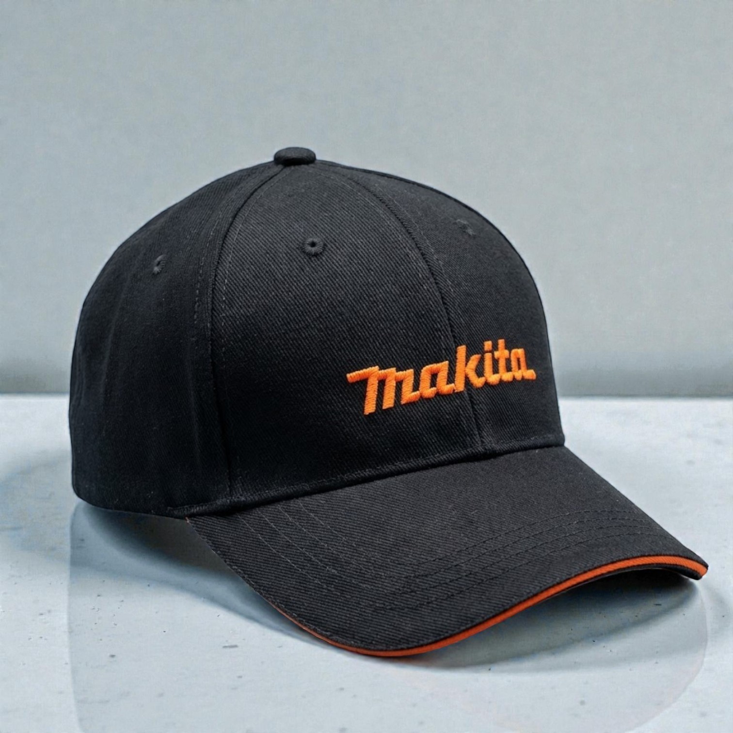 Black baseball cap with orange Makita logo—perfect for promotions or giveaway ideas.