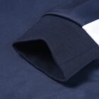Close-up of a Year 12 School Leaver Hoodie sleeve with white stripe and ribbed cuff.