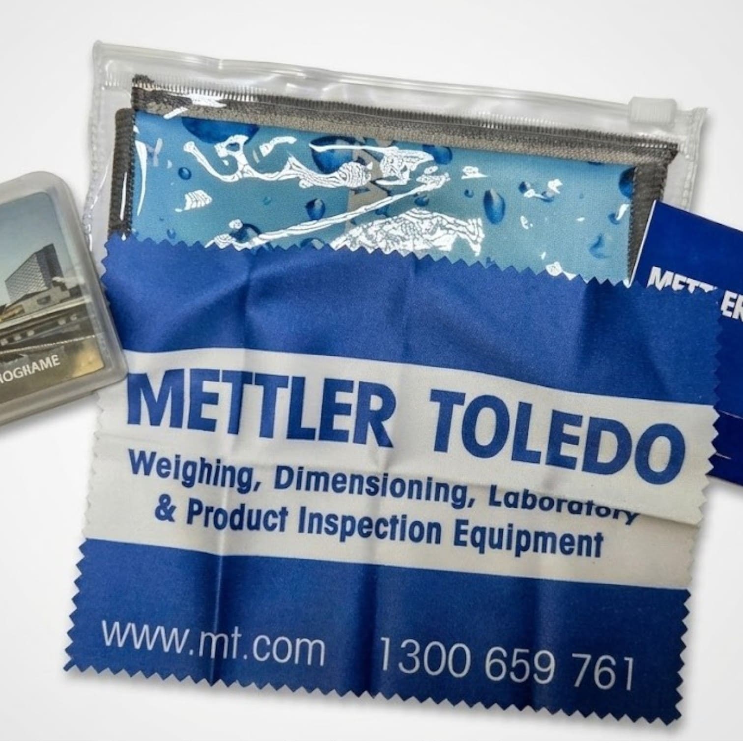 Blue and white Mettler Toledo cleaning cloth, reflecting product trends, on a branded pouch.