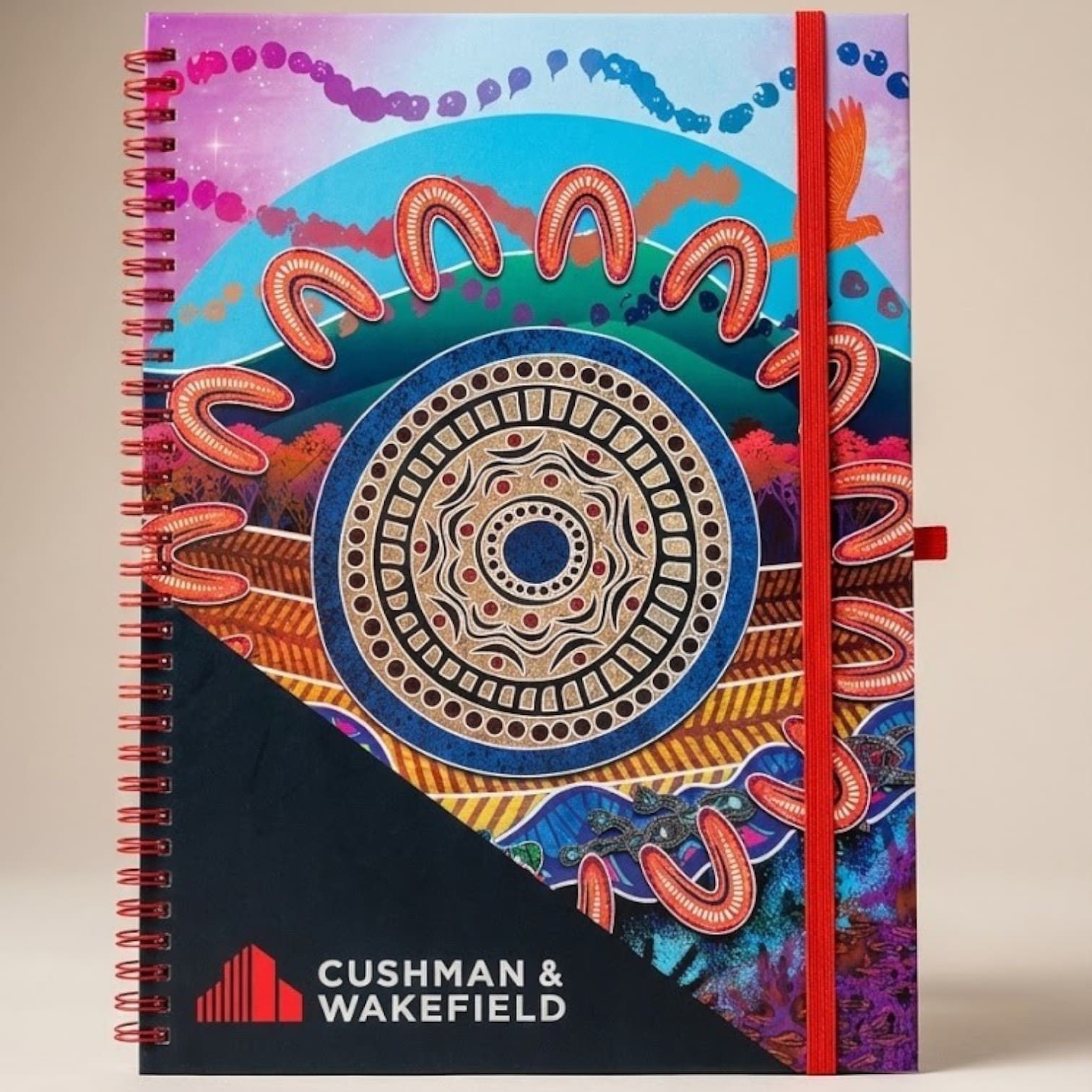 Colorful spiral-bound notebook with Aboriginal-inspired art reflects latest product trends.