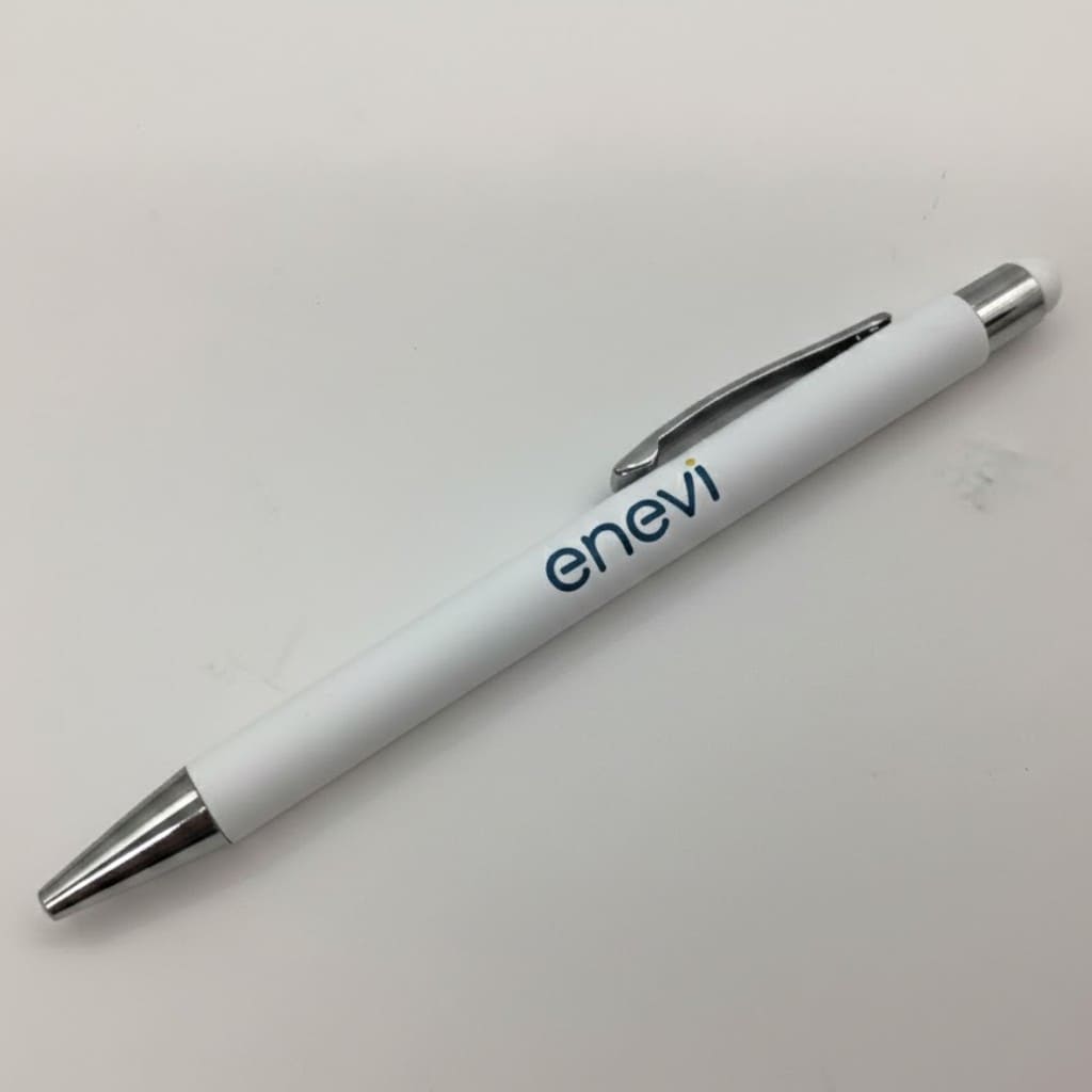 White ballpoint pen from the starter kit, enevi logo, metal tip, clip, and clicker on white background.