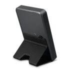 Black wireless charging stand viewed from the back, with a simple angled design.