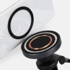 Close-up of a magnetic phone mount aligning with a phones circular magnet attachment.