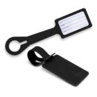 Two black luggage tags, one open showing a blank name and address label.