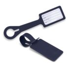 Two navy blue luggage tags, one showing a blank information card, the other flipped over.