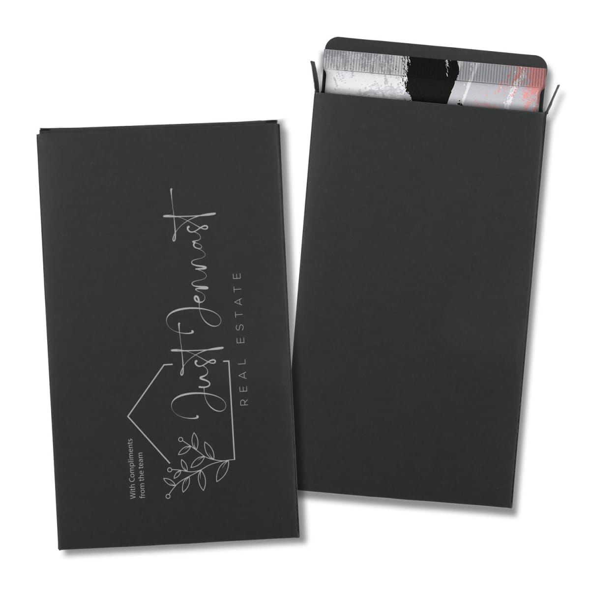 128489-0-20250408130452.jpg Two black envelopes, one open showing a gift card, with Just Pennast Real Estate text.