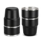 Two black stainless steel cups with silver rims, one stacked and one upright.