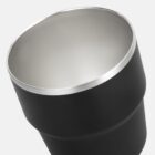 Close-up of a black and silver stainless steel tumbler cup against a white background.