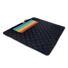 A black quilted picnic blanket with a folded section showing a rainbow stripe pattern.