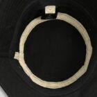 Inside view of a black hat with a white inner band and a visible label.